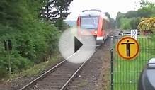 DB train entering and leaving Hennen station in Germany