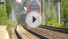 German commuter train leaving station into summer heat